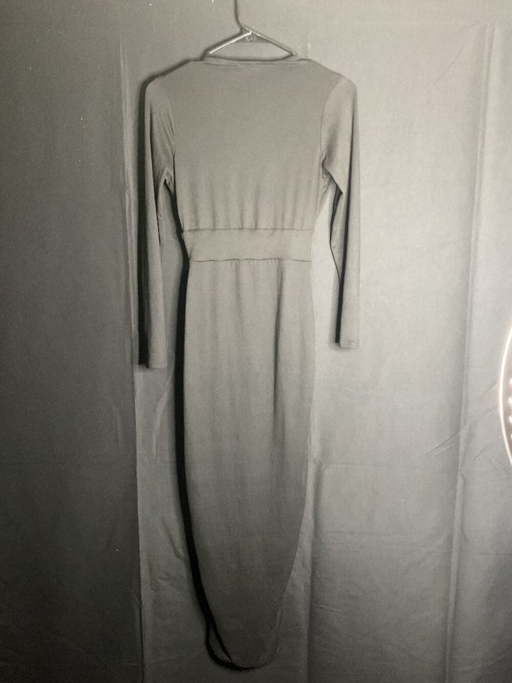x-small, figure-hugging silhouette black long-sleeve dress